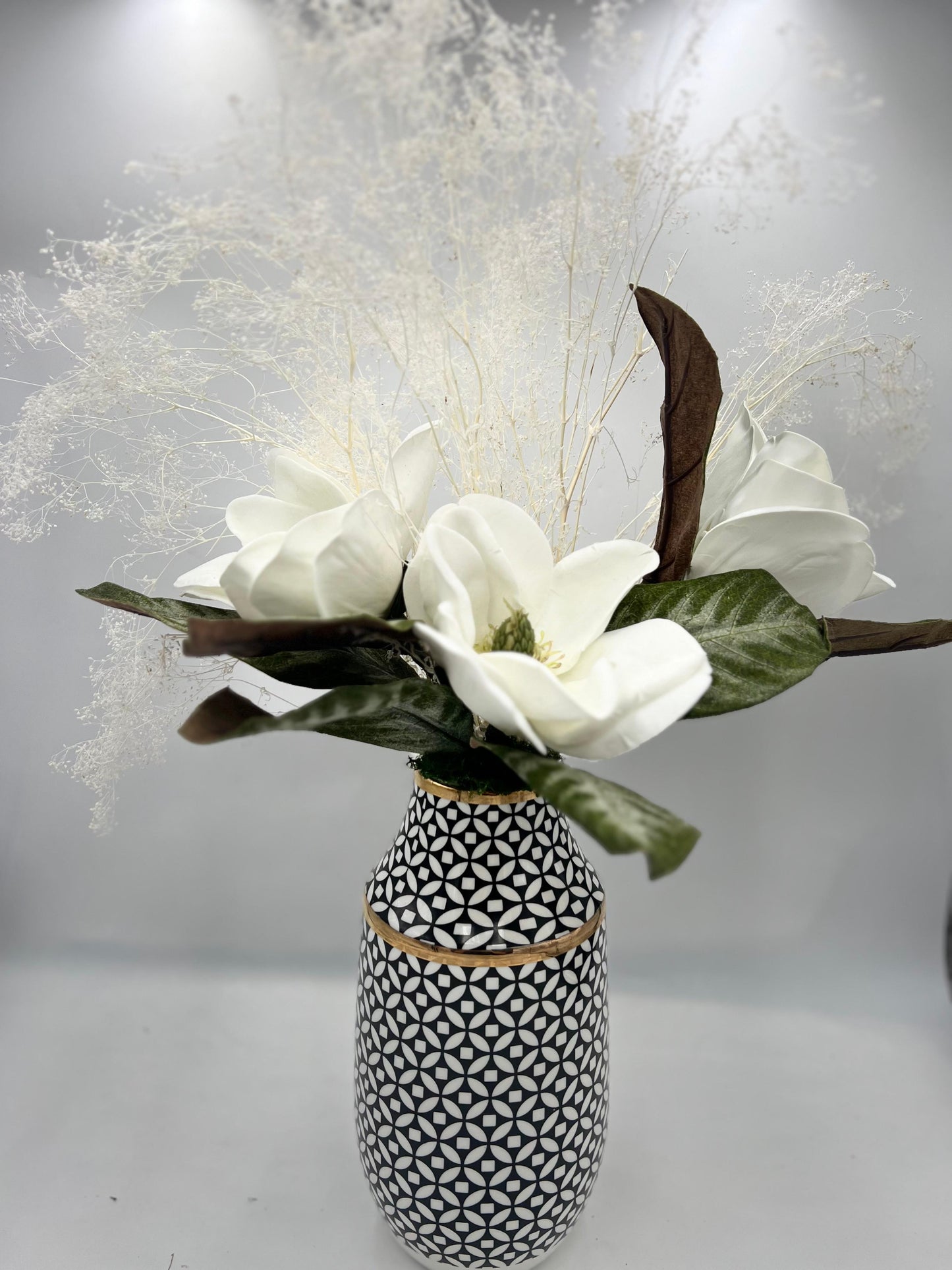 11.5" BLACK AND WHITE CIRCLE W/DIAMOND PATTERN VASE WITH FLORAL ARRANGEMENT